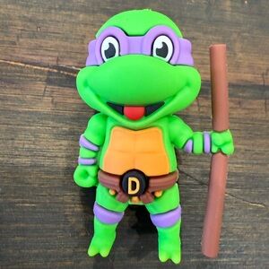 Green and Purple Ninja Turtle Figurine